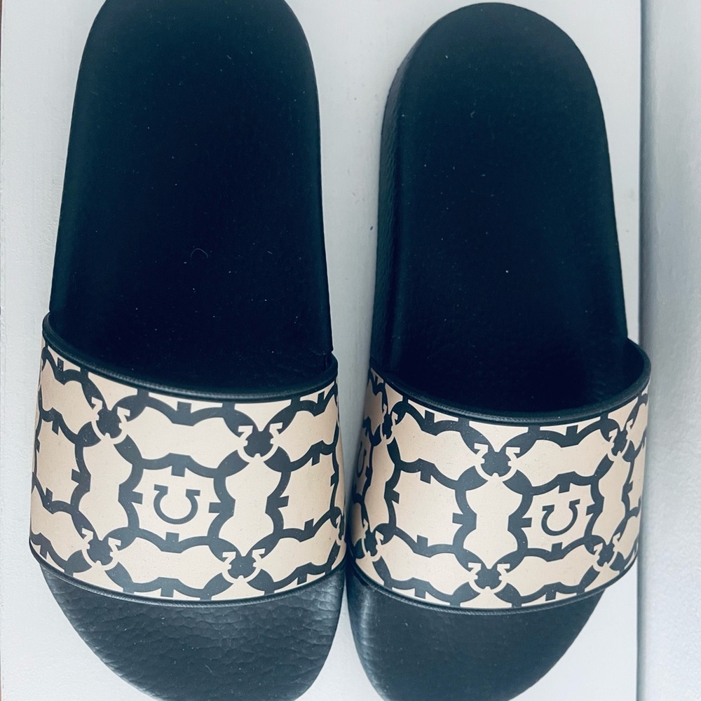Salvatore Ferragamo Groovy St pool slides.